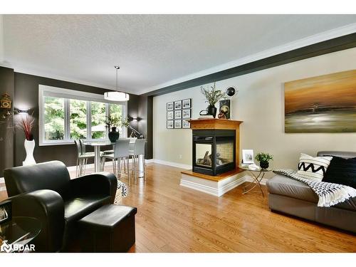 12 Lloyd Cook Drive E, Springwater, ON - Indoor Photo Showing Living Room With Fireplace