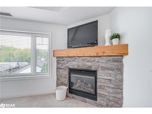 308-130 Steamship Bay Road, Gravenhurst, ON - Indoor Photo Showing Living Room With Fireplace