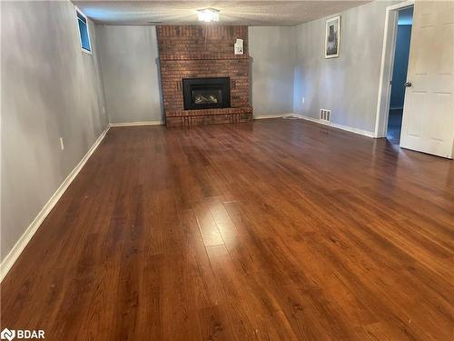 18 Craig Crescent, Barrie, ON - Indoor Photo Showing Living Room With Fireplace