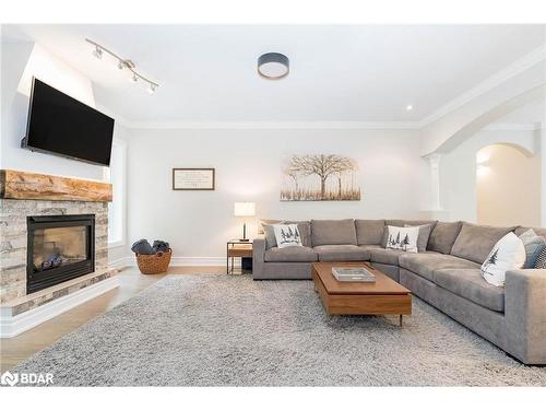 2 Reillys Run, Minesing, ON - Indoor Photo Showing Living Room With Fireplace