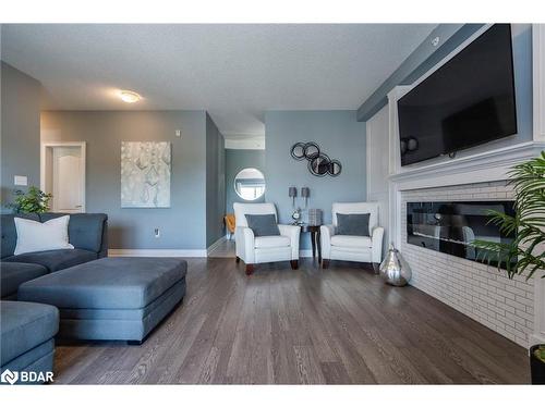 401-44 Ferndale Drive S, Barrie, ON - Indoor Photo Showing Living Room With Fireplace