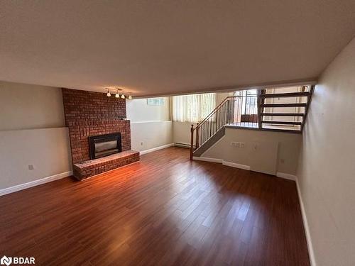 8 Hickling Trail, Barrie, ON - Indoor Photo Showing Living Room With Fireplace