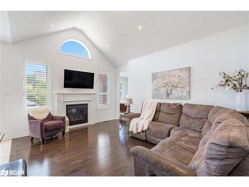 19 Cameron Street, Springwater, ON - Indoor Photo Showing Living Room With Fireplace