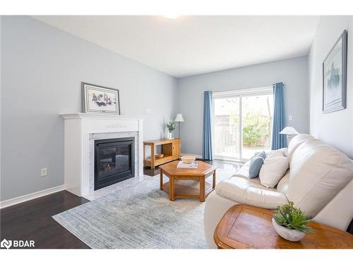 8 Orleans Avenue, Barrie, ON - Indoor Photo Showing Living Room With Fireplace