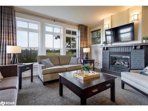 110-115 Fairway Court, The Blue Mountains, ON - Indoor Photo Showing Living Room With Fireplace