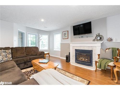 13 James Street, Penetanguishene, ON - Indoor Photo Showing Living Room With Fireplace