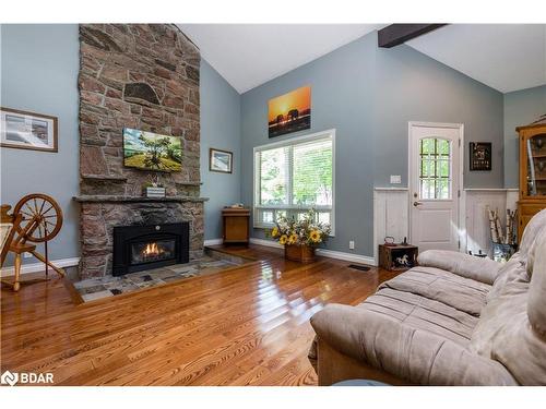 1032 Cowbell Lane, Severn Bridge, ON - Indoor Photo Showing Living Room With Fireplace