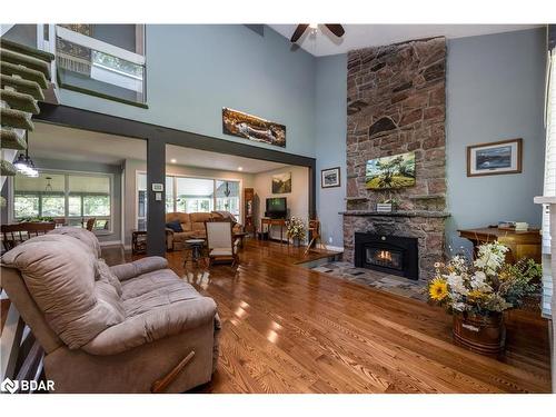 1032 Cowbell Lane, Severn Bridge, ON - Indoor Photo Showing Living Room With Fireplace