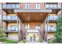 102-100 Dean Avenue, Barrie, ON  - Outdoor With Balcony With Facade 