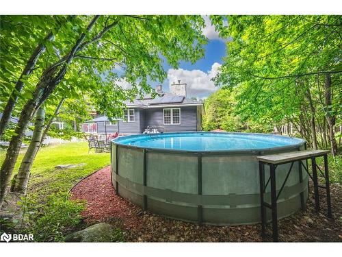 143 South Waseosa Lake Road, Huntsville, ON - Outdoor With Above Ground Pool With Backyard