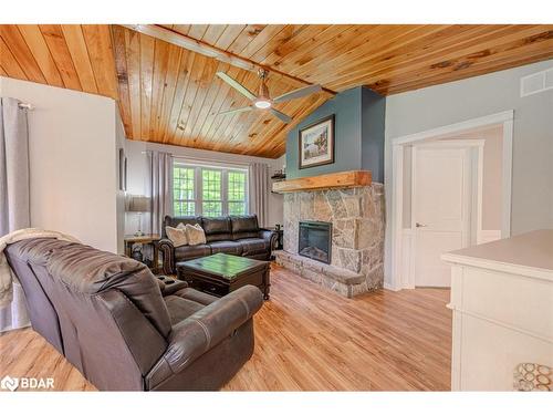 143 South Waseosa Lake Road, Huntsville, ON - Indoor Photo Showing Living Room With Fireplace