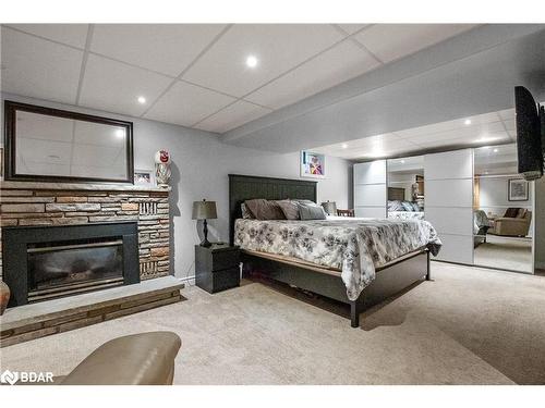 126 Adelaide Street N, Lindsay, ON - Indoor Photo Showing Bedroom With Fireplace