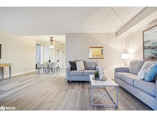 106-181 Collier Street, Barrie, ON - Indoor Photo Showing Living Room