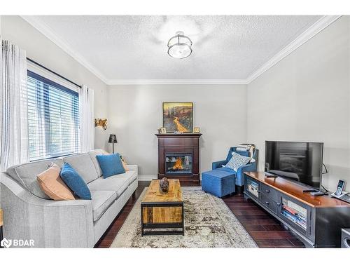 412-43 Ferndale Drive S, Barrie, ON - Indoor Photo Showing Living Room With Fireplace