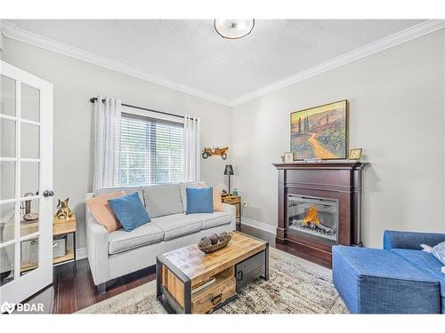 412-43 Ferndale Drive S, Barrie, ON - Indoor Photo Showing Living Room With Fireplace