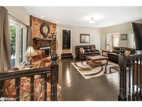 2038 Snow Valley Road, Springwater, ON - Indoor Photo Showing Living Room With Fireplace