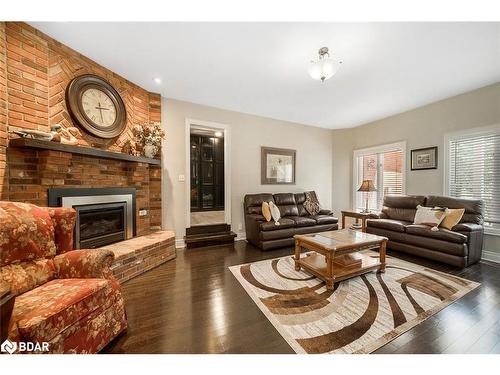 2038 Snow Valley Road, Springwater, ON - Indoor Photo Showing Living Room With Fireplace