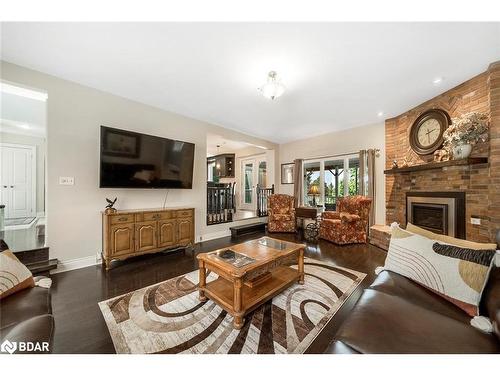 2038 Snow Valley Road, Springwater, ON - Indoor Photo Showing Living Room With Fireplace