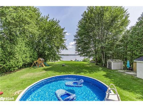 130 Crawford Road, Kawartha Lakes, ON - Outdoor With Above Ground Pool With Backyard