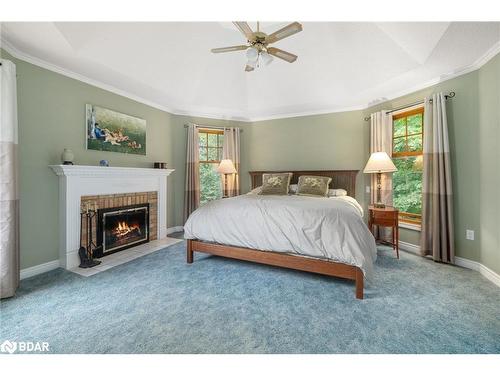 11 Aneva Court, Fenelon Falls, ON - Indoor Photo Showing Bedroom With Fireplace