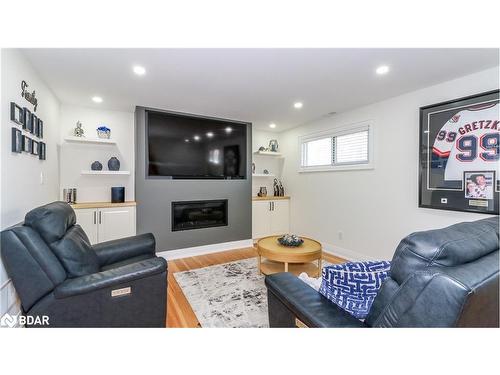 134 Switzer Street, New Lowell, ON - Indoor Photo Showing Living Room With Fireplace