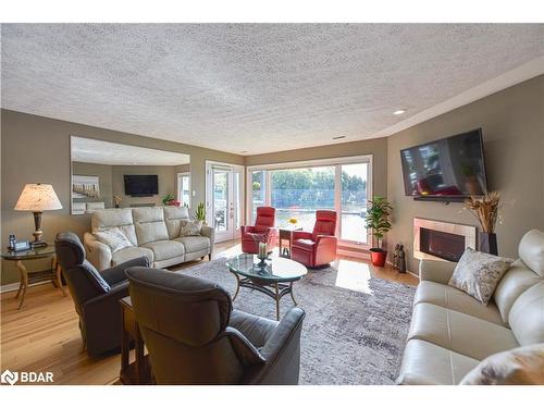 206-585 Atherley Road, Orillia, ON - Indoor Photo Showing Living Room With Fireplace