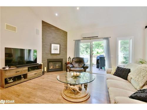 16 Macedonia Circle, Tiny, ON - Indoor Photo Showing Living Room With Fireplace