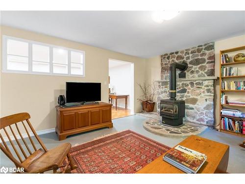 119 Silver Birch Drive, Tiny, ON - Indoor Photo Showing Living Room With Fireplace