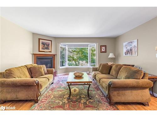 119 Silver Birch Drive, Tiny, ON - Indoor Photo Showing Living Room With Fireplace