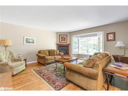 119 Silver Birch Drive, Tiny, ON - Indoor Photo Showing Living Room With Fireplace