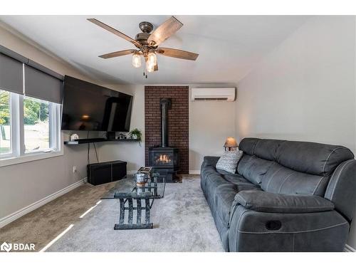 23 Leisure Court, Coldwater, ON - Indoor Photo Showing Living Room With Fireplace