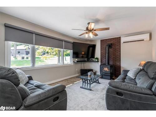 23 Leisure Court, Coldwater, ON - Indoor Photo Showing Living Room With Fireplace