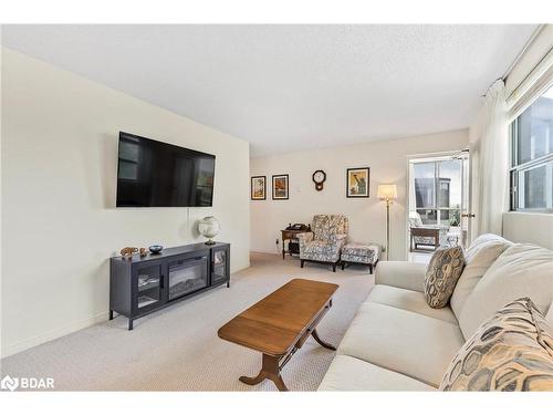 402-291 Blake Street, Barrie, ON - Indoor Photo Showing Living Room