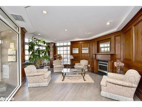 304-16 Raglan Street, Collingwood, ON - Indoor Photo Showing Living Room With Fireplace