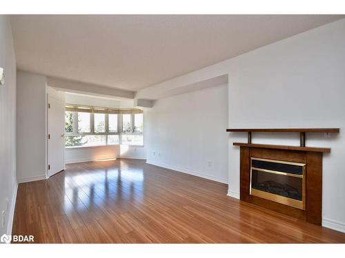 304-16 Raglan Street, Collingwood, ON - Indoor Photo Showing Living Room With Fireplace