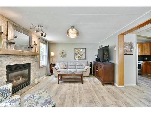 3 St. James Place, Wasaga Beach, ON - Indoor Photo Showing Living Room With Fireplace