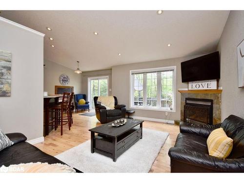 8 Nadia Crescent, Tiny, ON - Indoor Photo Showing Living Room With Fireplace