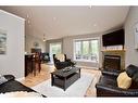 8 Nadia Crescent, Tiny, ON  - Indoor Photo Showing Living Room With Fireplace 