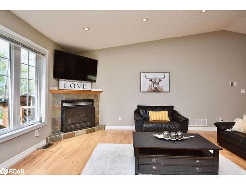 8 Nadia Crescent, Tiny, ON - Indoor Photo Showing Living Room With Fireplace