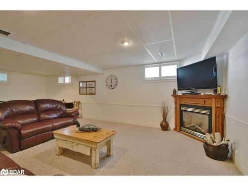 12 Willow Bay Drive, Springwater, ON - Indoor Photo Showing Basement With Fireplace