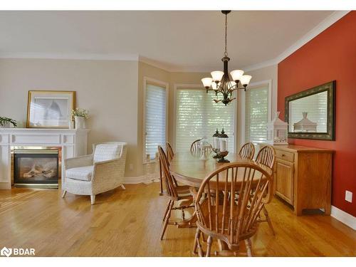 12 Willow Bay Drive, Springwater, ON - Indoor Photo Showing Dining Room With Fireplace