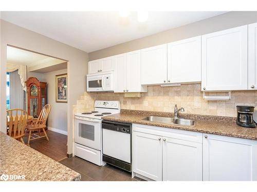 801-181 Collier Street, Barrie, ON - Indoor Photo Showing Kitchen With Double Sink