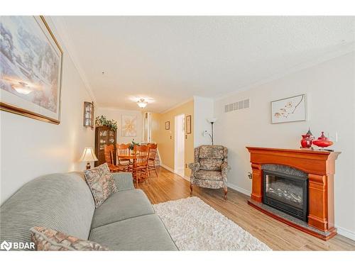 17A Cundles Road E, Barrie, ON - Indoor Photo Showing Living Room With Fireplace