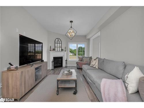 206 Prescott Drive, Stayner, ON - Indoor Photo Showing Living Room With Fireplace