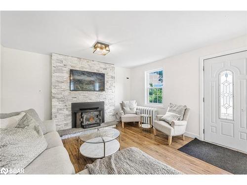 665 4 Line S, Oro-Medonte, ON - Indoor Photo Showing Living Room With Fireplace