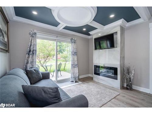 K1-155 Edgehill Drive, Barrie, ON - Indoor Photo Showing Living Room With Fireplace