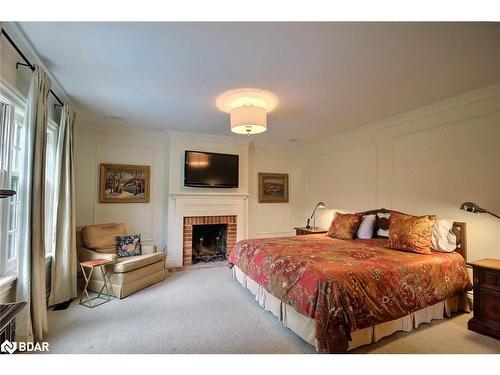 181 Peter Street N, Orillia, ON - Indoor Photo Showing Bedroom With Fireplace