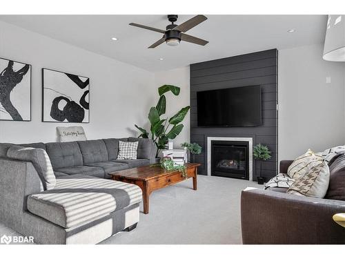 95 Trail Boulevard, Minesing, ON - Indoor Photo Showing Living Room With Fireplace