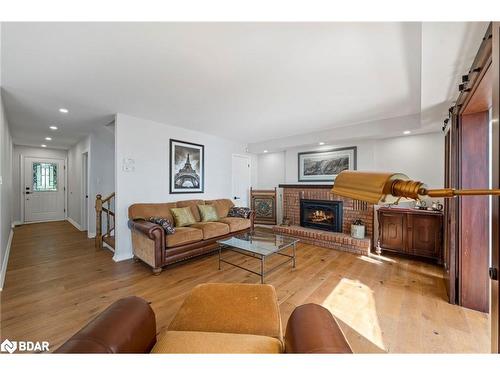 38 Willow Drive, Tiny, ON - Indoor Photo Showing Living Room With Fireplace