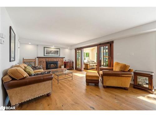 38 Willow Drive, Tiny, ON - Indoor Photo Showing Living Room With Fireplace